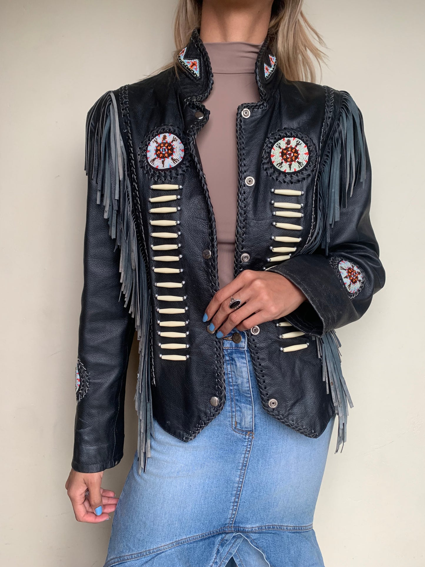 Leather jacket with fringe